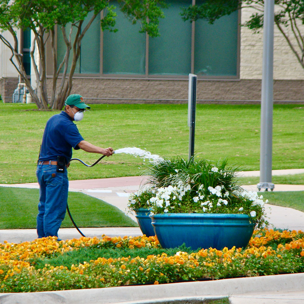 A member of our Landscaping & Grounds staff works to keep the campus looking beautiful.