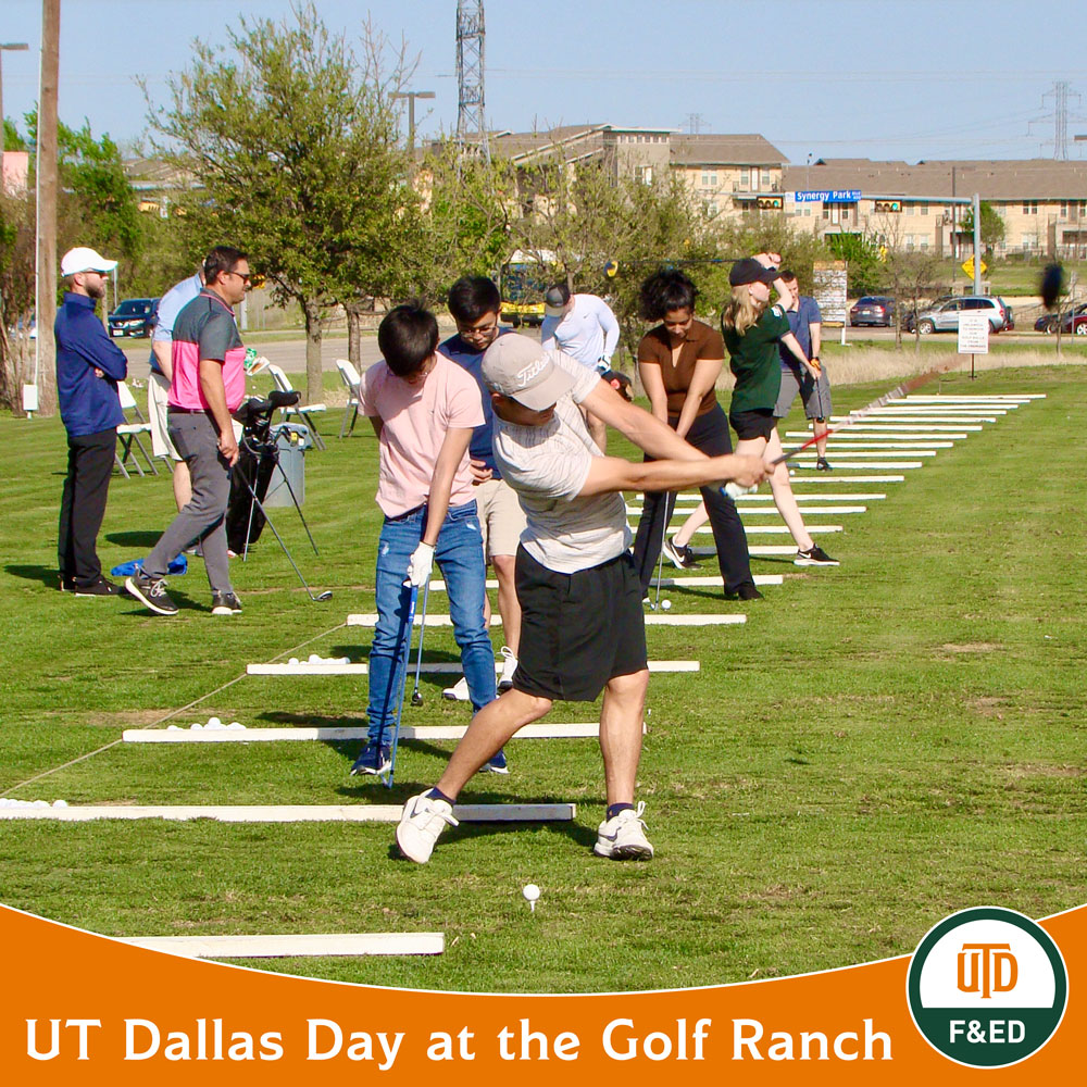 A line of students practice their golf swings while instructors from The Golf Ranch observe them and offer advice. Text at the bottom reads “UT Dallas Day at The Golf Ranch”.
