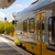 The under-construction DART station reflected back in the train’s panels.